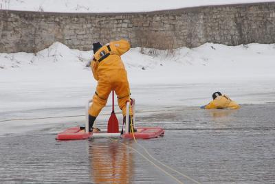 Firefighters in action on frozen ice